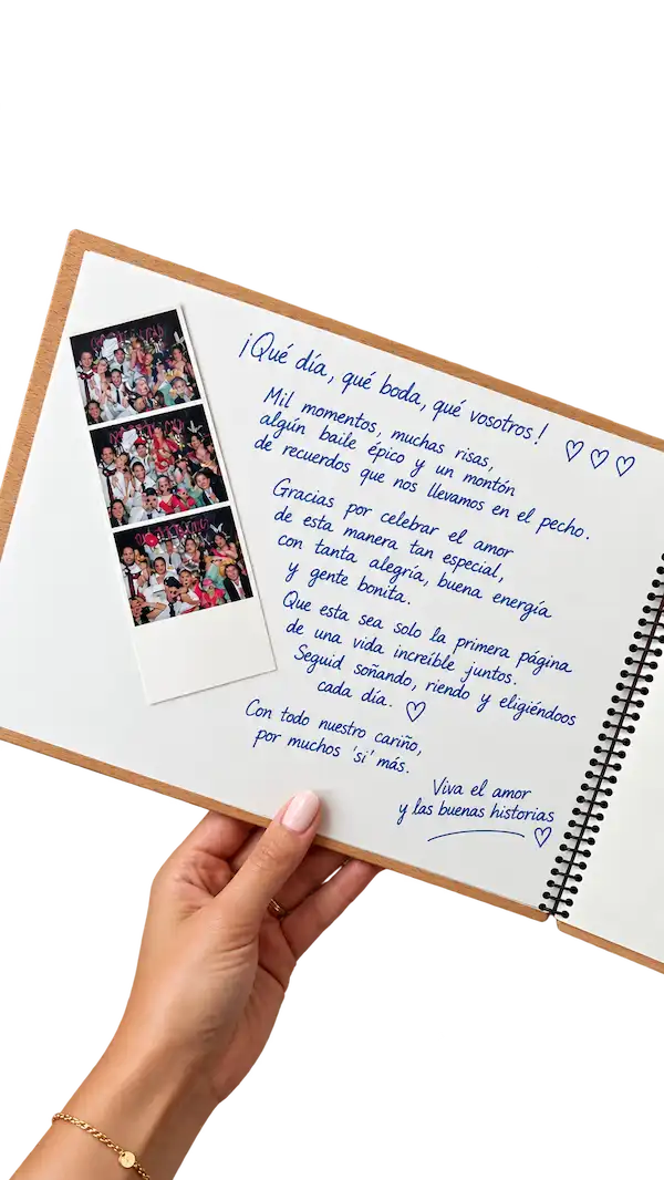 Álbum de firmas abierto con una tira de fotos del fotomatón y una dedicatoria manuscrita
